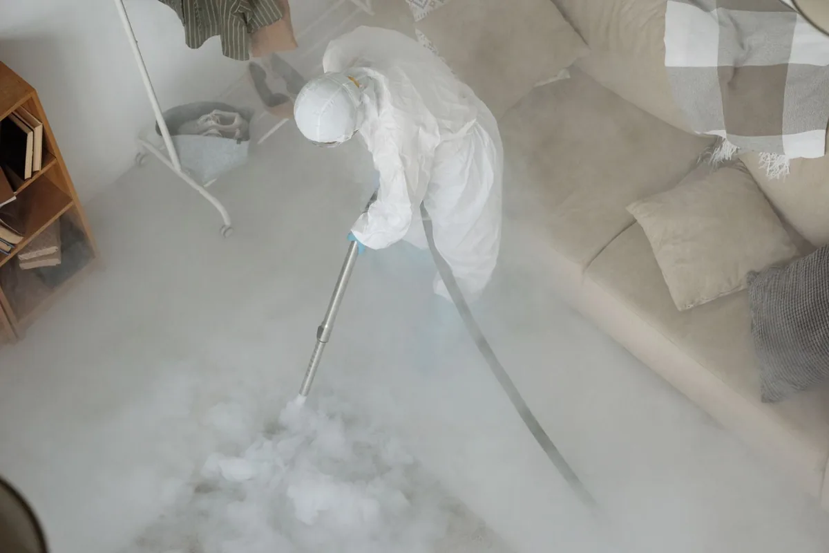 Biohazard cleanup technician in protective equipment, Bolindale, OH